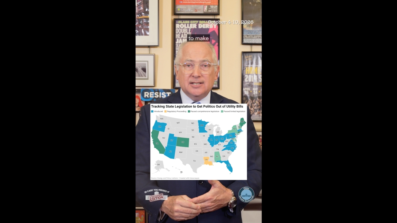 Senator Kent Smith with a map showing states that have passed legilsation to get politics out of utility bills